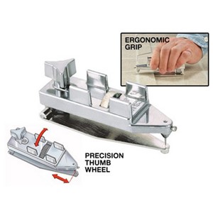 The hinge scriber is a sheet vinyl seam scriber designed for accuracy, ease of adjustment, and for good grip and control. The offset distance between the bottom guide and the needle is adjusted using a precision thumbwheel. Once adjusted, the three arm knob locks the needle in position. The hinged base allows the tool to be more easily inserted at the seam, particularly on thick material. With the hinge folded open, insert the base under the material on top and hook the guide on the edge of the material und