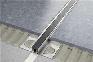 Schluter-DILEX-KSN features trapezoid-perforated anchoring legs, made of stainless steel or aluminum, which are secured in the mortar bond coat and provide edge protection for adjacent tiles. The profile separates individual fields in the tile covering and accommodates movement via the 7/16&quot; (11 mm)-wide, soft thermoplastic rubber movement zone, which also forms the visible surface. The thermoplastic rubber movement zone can be replaced if damaged.
