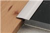Schluter-RENO-T is designed to provide transitions between existing, same-height, hard surface floor coverings, primarily in retrofit applications (e.g., ceramic or natural stone, parquet flooring, concrete pavers, laminate, etc). Prevents tile edges from chipping. Ideal for floor installations where tile is bordered by wood, laminate, or other hard floor coverings. Designed for floor transitions in retrofit applications. In certain materials and sizes, the profile is flexible and can be used to form curves. Available in stainless steel, solid brass, and anodized aluminum.