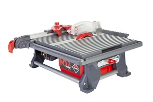 The RUBI ND-7 IN MAX tile saw is a portable tabletop cutter, especially recommended for renovating interiors (bathrooms and kitchens). It is suitable for professional cutting of glazed tile (flooring) and decorative tiles (wall tiles). Still, It can also be recommended for the occasional cutting of porcelain tiles or other materials (natural stone or sintered stone). The ND-7 IN MAX has a machined aluminum table with one folding side for miter cutting at 22.5&#186; and 45&#186;. The table also has a perimeter settling system that collects a large part of the used water and returns it to the tank. Integrated into the chassis, thus achieving a cleaner work environment and better water use, considerably reducing the number of refills needed for the tank. The ND-7 IN MAX cutting table has an extruded aluminum fence, which is easily adjusted and locked with maximum safety, guaranteeing a large and resistant support surface and precise, repetitive cuts. The cutter includes a 7&quot; inche blade for general cutting of all types of tile, including ceramic, porcelain, and stone. The blade is cooled by direct immersion in the water in the integrated tank.