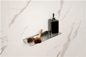 Schluter-SHELF-W is a wall storage system available in brushed stainless steel. The shelves are 5/32&quot; (4 mm) -thick and features designs coordinating with the Curve and Floral styles found in KERDI-DRAIN and KERDI-LINE drain grates. They can be used in showers and other tiled wall applications (e.g., kitchens and baths). SHELF-W is a rectangular shelf with two trapezoid-perforated anchoring legs for installation on walls in conjunction with the tile.