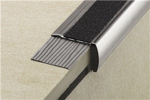 Schluter-TREP-G and TREP-GK are designed to protect tiled stair edges and provide an easily visible, slip-resistant wear surface for a durable, safe and visually appealing stair-nosing design. TREP-GK is subsequently bonded to existing applications (i.e. as a repair). Prevents tile edges on stairs from chipping. Ensures a slip-resistant wear surface Features a self-adhesive slip-resistant tread with colored embedded mineral grain coating (various colors available). Slip-resistant tread is replaceable. Features a stainless steel anchoring leg which is embedded in the tile bond coat. Ideal for offices, shopping malls, and other public areas. TREP-GK is installed as a retrofit application. End caps available. Available in brushed stainless steel.