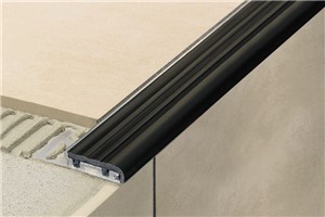 Schluter-TREP-SE, Schluter-TREP-S and Schluter-TREP-B are designed to protect tiled stair edges and provide an easily visible, slipresistant wear surface for durable, safe, and visually appealing stair-nosing design. They are suitable for use in areas subjected to heavy foot-traffic, such as offices or public buildings. The profiles feature a trapezoid-perforated anchoring leg made of stainless steel (TREP-SE) or aluminum (TREP-S and TREP-B), which is secured in the mortar bond coat beneath the tile and supports a slip-resistant thermoplastic rubber wear surface. The tread surface of TREP-SE/-S/-B is available in a variety of colors and can be replaced in case of damage or wear. TREP-B features a 2-1/8&quot; (52 mm)-wide wear surface, allowing the designer to easily produce stairs with the first and last steps marked by a 2&quot; (50 mm)- wide strip in a contrasting color to increase visibility and safety.